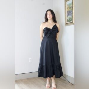 Hutch x Anthropologie Strapless Bow-Front Tiered Ruffle Hem Midi Dress in Black